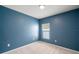 Blue bedroom with window and carpet at 12120 Barnsley Reserve Pl, Gibsonton, FL 33534