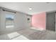 Bright bedroom with gray and pink walls at 12120 Barnsley Reserve Pl, Gibsonton, FL 33534