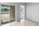 Laundry room with sliding glass door to backyard at 12120 Barnsley Reserve Pl, Gibsonton, FL 33534