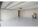 Garage with light-colored floor and water heater at 12120 Barnsley Reserve Pl, Gibsonton, FL 33534