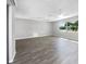 Spacious living area featuring hardwood floors and ample natural light at 1019 Deer Run, Venice, FL 34293
