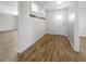 Bright entryway with wood-look floors and shiplap wall at 1019 Deer Run, Venice, FL 34293