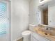 Clean bathroom with single vanity and toilet at 1019 Deer Run, Venice, FL 34293