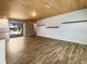 Spacious living area with wood-look floors and wood ceiling at 1019 Deer Run, Venice, FL 34293