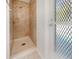 Walk-in shower with updated tile and glass door at 1019 Deer Run, Venice, FL 34293