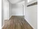 Clean entryway with wood-look tile floor and shiplap wall at 1019 Deer Run, Venice, FL 34293