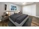 Main bedroom with large closet and wood-look floors at 1019 Deer Run, Venice, FL 34293