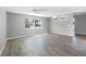 Large living room with tile floor and big windows at 1019 Deer Run, Venice, FL 34293
