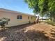 Updated house exterior with new paint and landscaping at 1019 Deer Run, Venice, FL 34293
