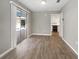 Bright dining room with wood-look tile floors and sliding glass doors at 1019 Deer Run, Venice, FL 34293