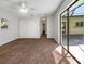 Spacious bedroom with carpet and sliding glass doors at 1019 Deer Run, Venice, FL 34293