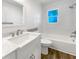 Updated bathroom with white vanity and walk-in shower at 1019 Deer Run, Venice, FL 34293