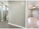 Bright bathroom featuring modern tile flooring and an open doorway to the bedroom at 9308 San Bernandino Ave, Englewood, FL 34224