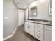 Stylish bathroom showcasing sleek white cabinets, granite countertops, and modern fixtures at 9308 San Bernandino Ave, Englewood, FL 34224