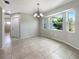 Bright dining room with large windows and tile flooring at 9308 San Bernandino Ave, Englewood, FL 34224