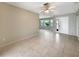 Spacious living room with tile flooring and natural light at 9308 San Bernandino Ave, Englewood, FL 34224