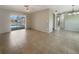 Living room with sliding glass doors to the screened in pool at 9308 San Bernandino Ave, Englewood, FL 34224