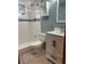 Clean bathroom with a shower/tub combo and updated fixtures at 1620 Lakeview Pl, Englewood, FL 34223
