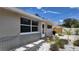 Updated house exterior, featuring a landscaped walkway and newly painted siding at 1620 Lakeview Pl, Englewood, FL 34223