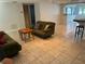 Spacious living room featuring tile floors and ample natural light at 1620 Lakeview Pl, Englewood, FL 34223