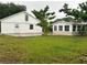 Spacious backyard with detached garage and additional structure at 1620 Lakeview Pl, Englewood, FL 34223