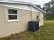 AC unit and exterior wall of the house at 1620 Lakeview Pl, Englewood, FL 34223