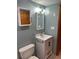 Updated bathroom with a vanity, toilet and shower at 1620 Lakeview Pl, Englewood, FL 34223