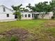 Large backyard with detached garage and home at 1620 Lakeview Pl, Englewood, FL 34223