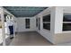 Covered patio with access to the back yard at 1620 Lakeview Pl, Englewood, FL 34223