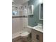 Clean bathroom with a shower/tub combo and updated fixtures at 1620 Lakeview Pl, Englewood, FL 34223