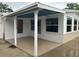 Covered patio with access to the interior at 1620 Lakeview Pl, Englewood, FL 34223