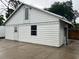 Detached garage with additional storage and a loft area at 1620 Lakeview Pl, Englewood, FL 34223
