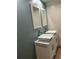 Bathroom with double vanity, marble countertop, and updated fixtures at 1620 Lakeview Pl, Englewood, FL 34223