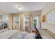 Bright home office features a desk, sliding glass doors to a bedroom, and ample natural light at 1433 S Belcher Rd # C1, Clearwater, FL 33764