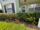 Landscaped exterior with manicured hedges and grass at 1433 S Belcher Rd # C1, Clearwater, FL 33764