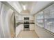 Bright kitchen featuring stainless steel appliances and tiled floors at 1433 S Belcher Rd # C1, Clearwater, FL 33764