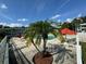 Community pool with palm trees and lounge chairs at 1433 S Belcher Rd # C1, Clearwater, FL 33764