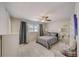 Large bedroom with a queen bed, ceiling fan, and tiled floors at 1433 S Belcher Rd # C1, Clearwater, FL 33764