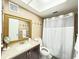 Bathroom with tiled walls, a shower, and a vanity at 1433 S Belcher Rd # C1, Clearwater, FL 33764