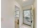 Clean entryway with tiled floors and an exterior door at 1433 S Belcher Rd # C1, Clearwater, FL 33764