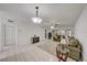 Spacious living room with tiled floors, a couch and a ceiling fan at 1433 S Belcher Rd # C1, Clearwater, FL 33764