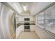 Bright kitchen featuring stainless steel appliances and tiled floors at 1433 S Belcher Rd # C1, Clearwater, FL 33764
