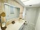 Clean bathroom with tiled floors and a large mirror at 1433 S Belcher Rd # C1, Clearwater, FL 33764