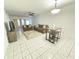 Spacious living room with tiled floors and neutral decor at 1433 S Belcher Rd # C1, Clearwater, FL 33764
