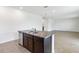 Kitchen island with double sink and granite countertop at 9034 Sandy Bluffs Cir, Parrish, FL 34219