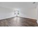Bright bedroom featuring wood-look flooring and large windows at 9034 Sandy Bluffs Cir, Parrish, FL 34219