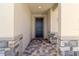 Front entry with dark door and stone accents at 9034 Sandy Bluffs Cir, Parrish, FL 34219