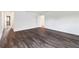 Primary bedroom with wood-look floors and access to bathroom at 9034 Sandy Bluffs Cir, Parrish, FL 34219