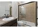 Small bathroom with a walk-in shower and single vanity at 9034 Sandy Bluffs Cir, Parrish, FL 34219