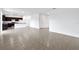 Open living room and kitchen with tile floors at 9034 Sandy Bluffs Cir, Parrish, FL 34219